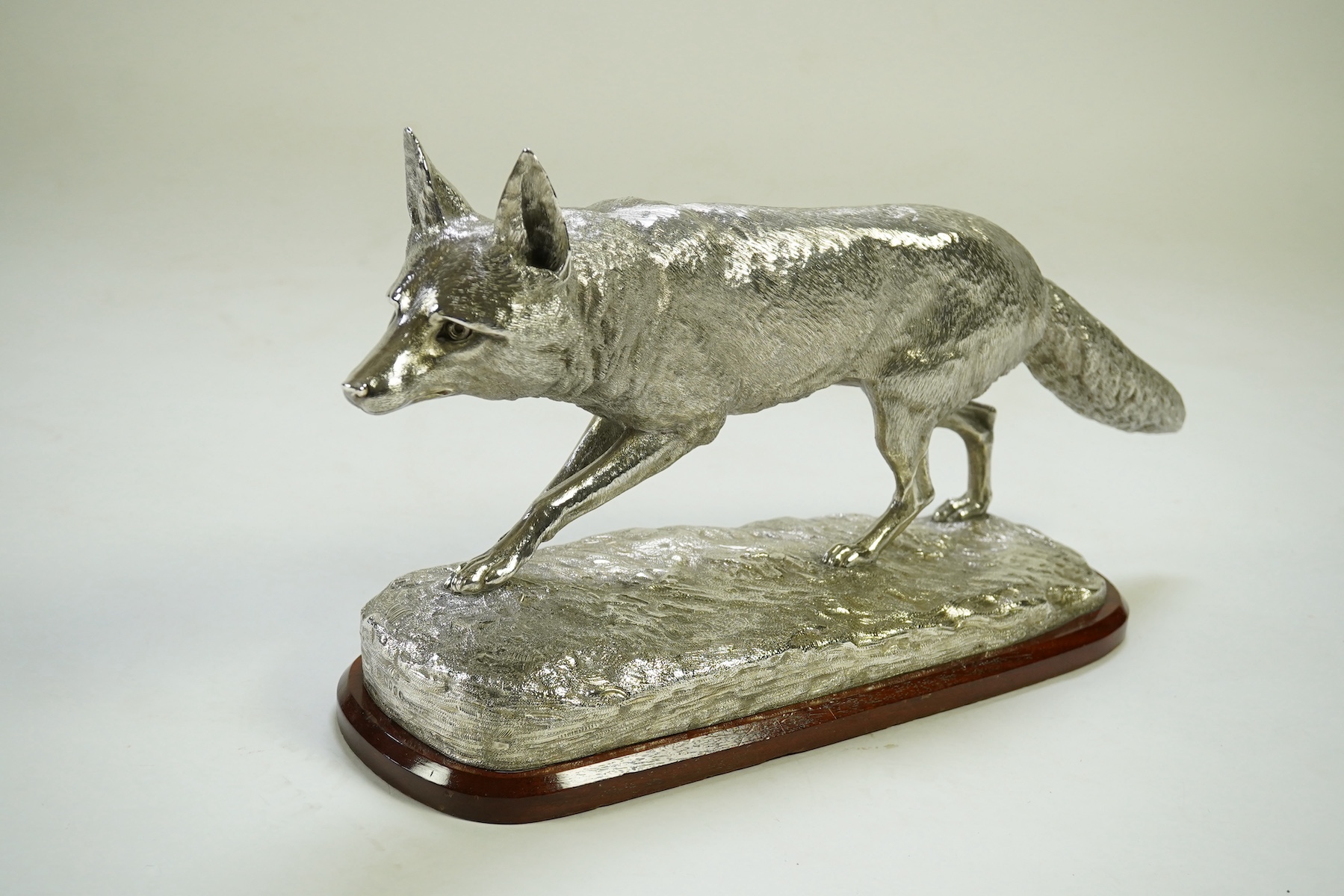 An impressive Victorian silver sculpture of a fox en passant, by R & S Garrard & Co (Robert Garrard II)